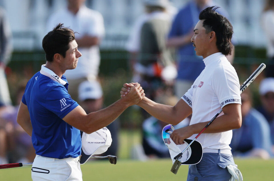 LOS ANGELES, CALIFORNIA - JUNE 18: Min Woo Lee of Australia shakes hands with Viktor Hovland of Norway on the 18th green during the final round of the 123rd U.S. Open Championship at The Los Angeles Country Club on June 18, 2023 in Los Angeles, California. (Photo by Harry How/Getty Images)