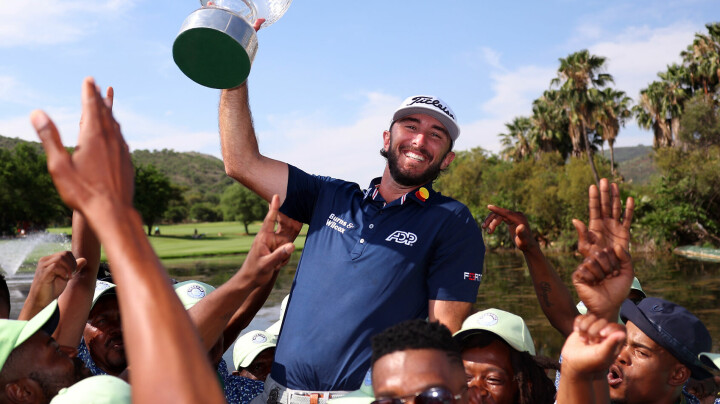 SUN CITY, SOUTH AFRICA - NOVEMBER 12: Max Homa of the United States holds the trophy as he celebrates victory with ground staff after winning the tournament during Day Four of the Nedbank Golf Challenge at Gary Player CC on November 12, 2023 in Sun City, South Africa. (Photo by Warren Little/Getty Images)