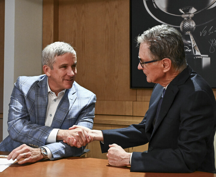 PONTE VEDRA BEACH, FL - JANUARY 31: PGA TOUR Commissioner Jay Monahan and John Henry, Principal, Fenway Sports Group, shake hands after signing an agreement announcing the launch of PGA TOUR Enterprises in partnership with Strategic Sports Group (SSG) at the PGA TOUR Global Home on January 31, 2024 in Ponte Vedra Beach, Florida. (Photo by Chris Condon/PGA TOUR via Getty Images)